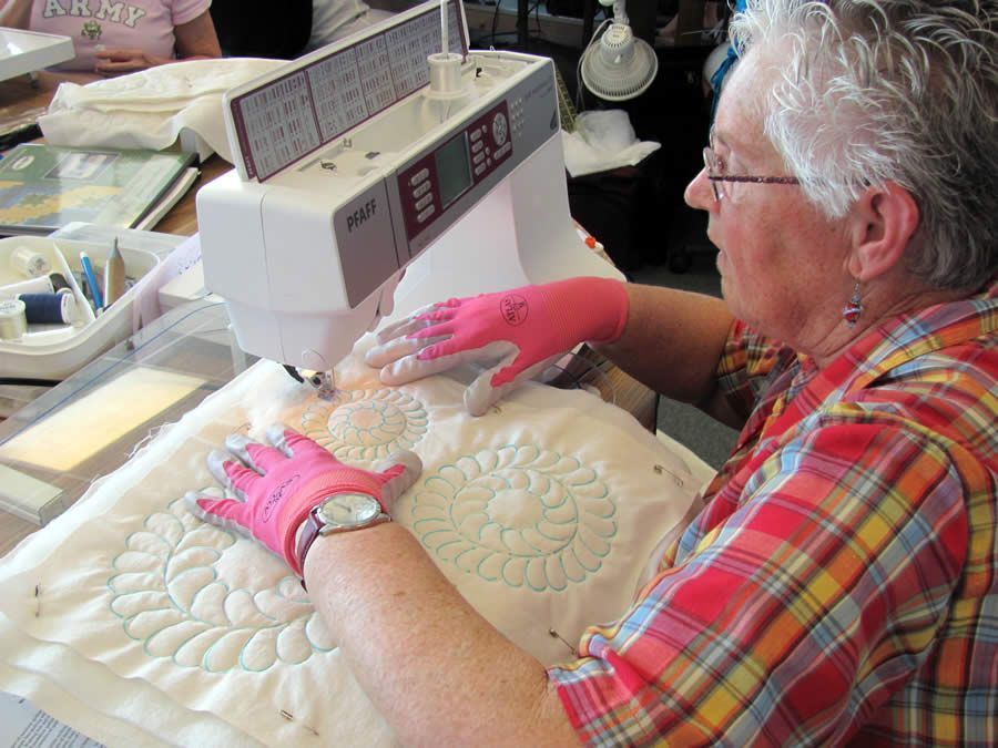 Woman sewing her Beginning Machine Quilting project